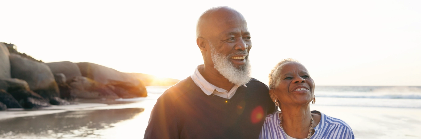 Senior couple walking on the beach