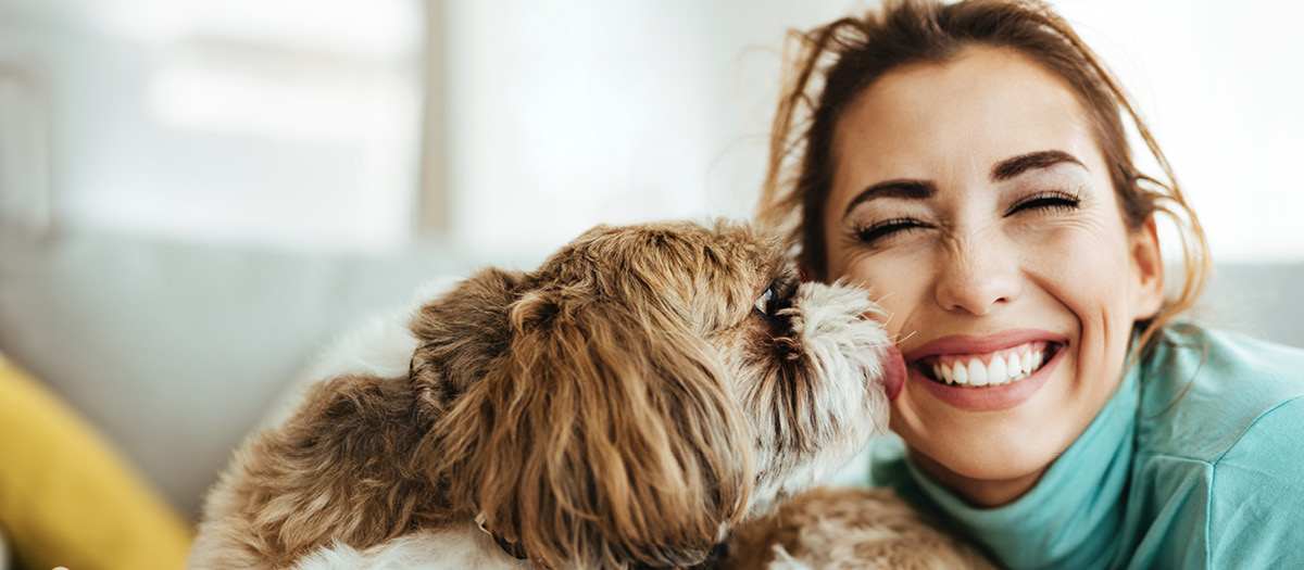 woman smiling with dog