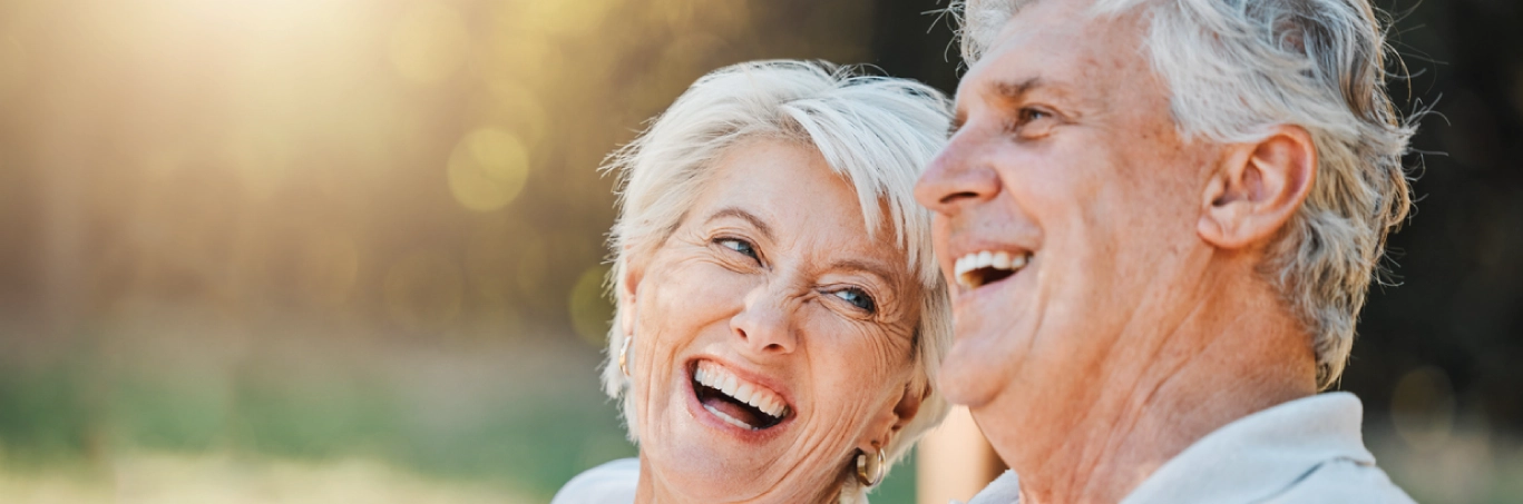 Senior couple outside smiling