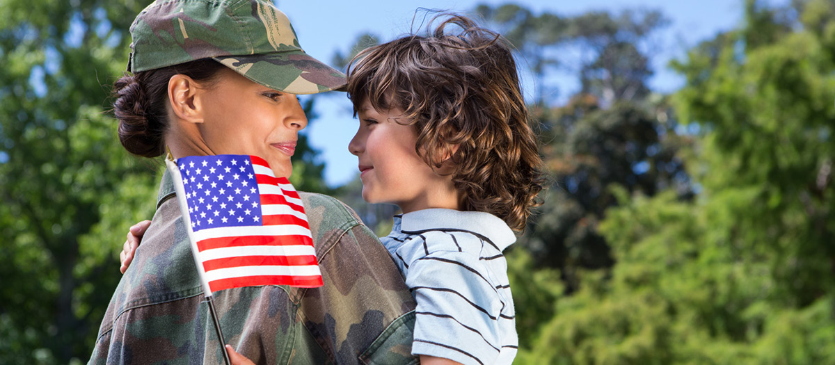 veteran smiling with child